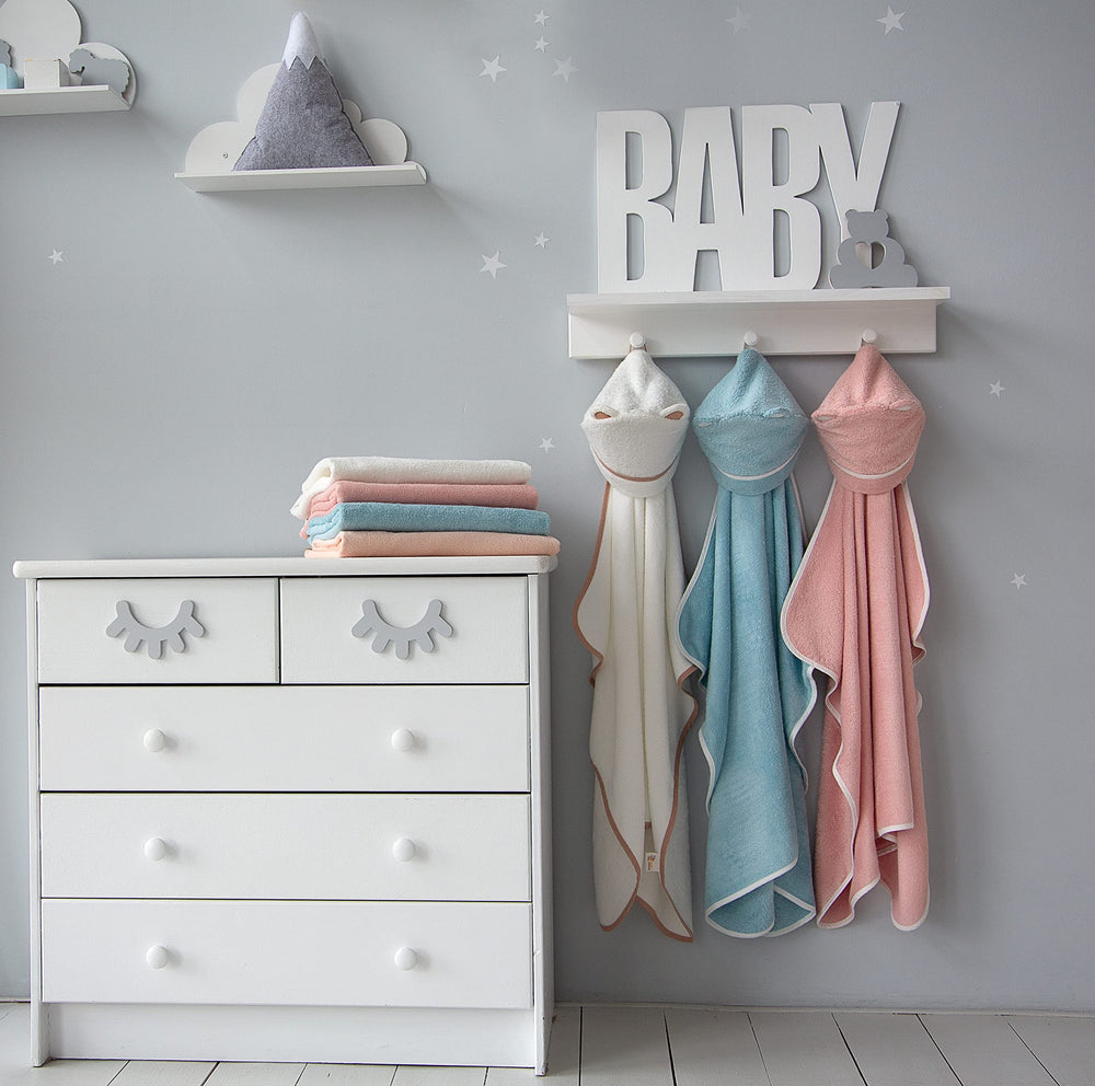 Warm Cuddles gift-ready packaging suggests a thoughtful present for new parents.