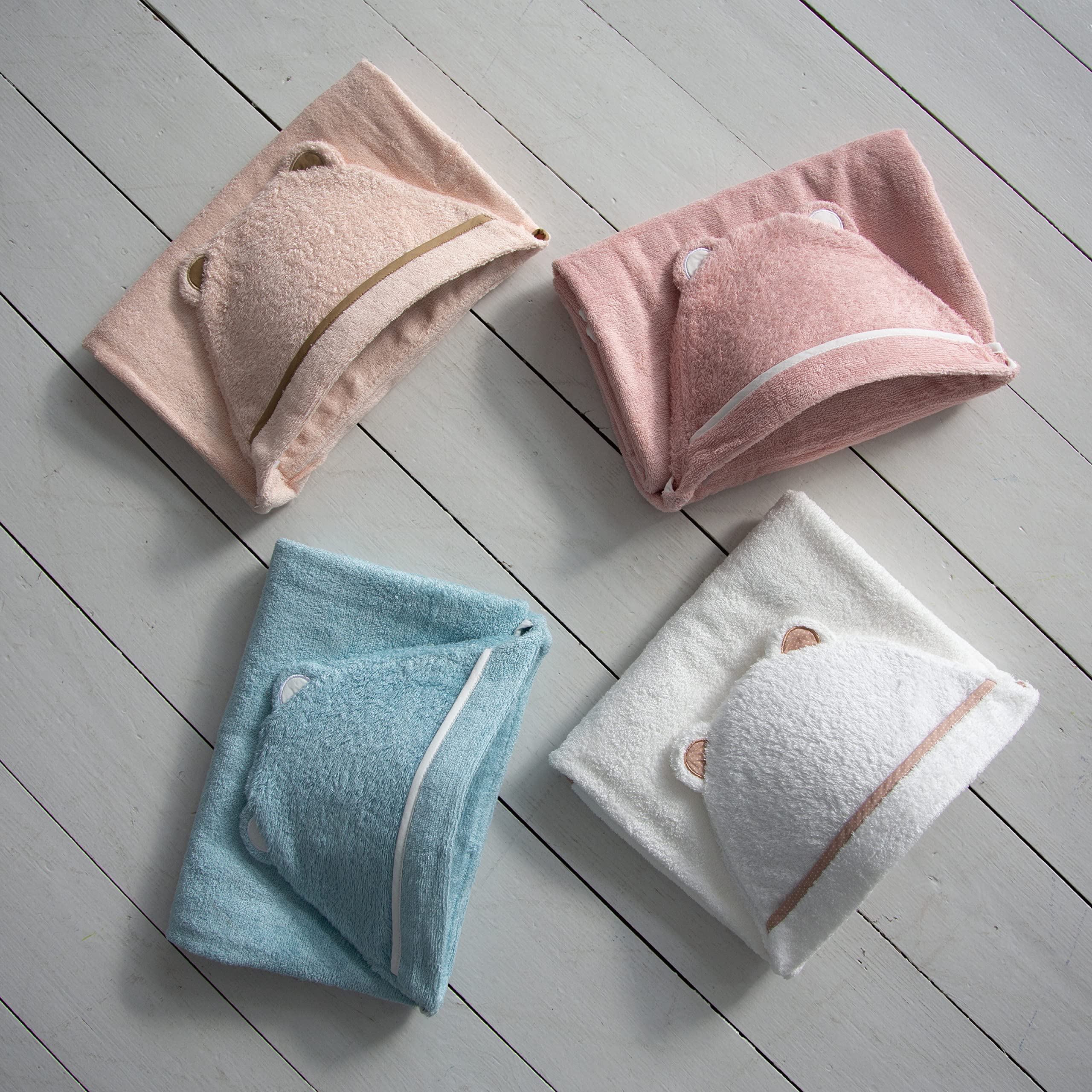Warm Cuddles pink hooded towel, absorbs moisture quickly after baths.