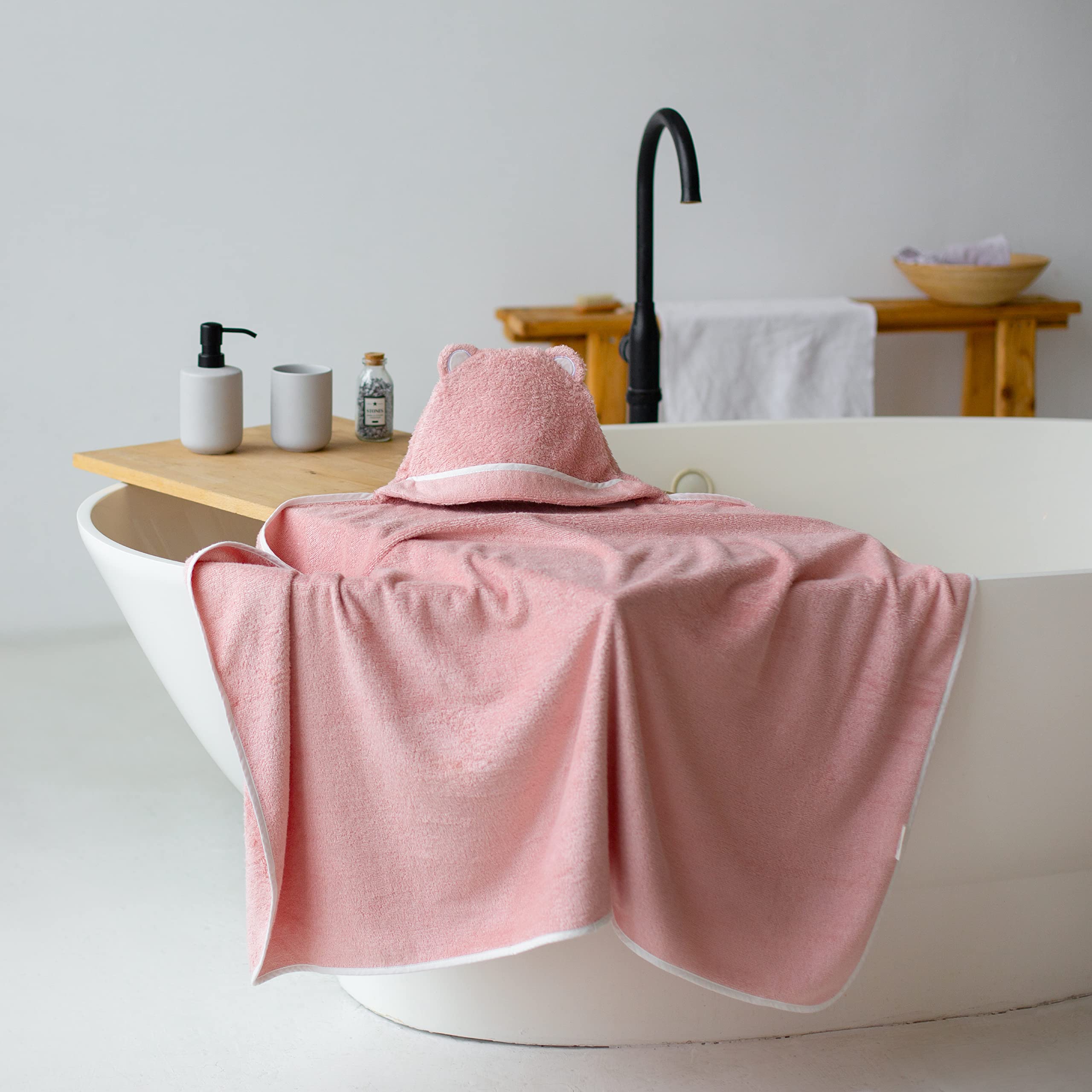 Warm Cuddles pink hooded towel, durable stitching reduces snags.