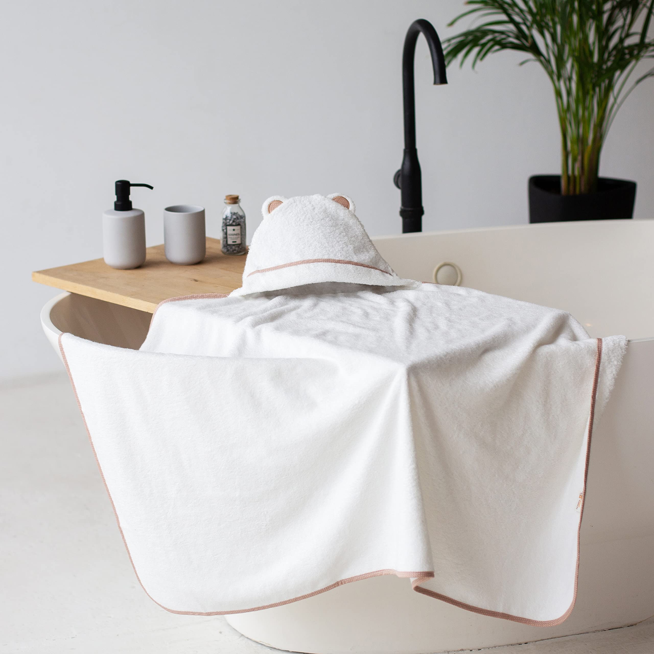 Warm Cuddles bamboo material emphasizes hypoallergenic, natural baby care.