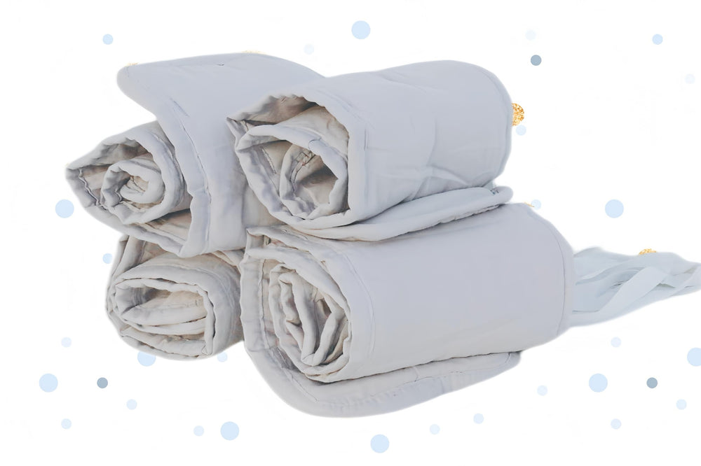 Soft protective wrap by Wazzo keeps crib edges guarded