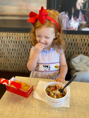 Wee Ones ensemble on a baby girl highlights coordinated bow and headband set.