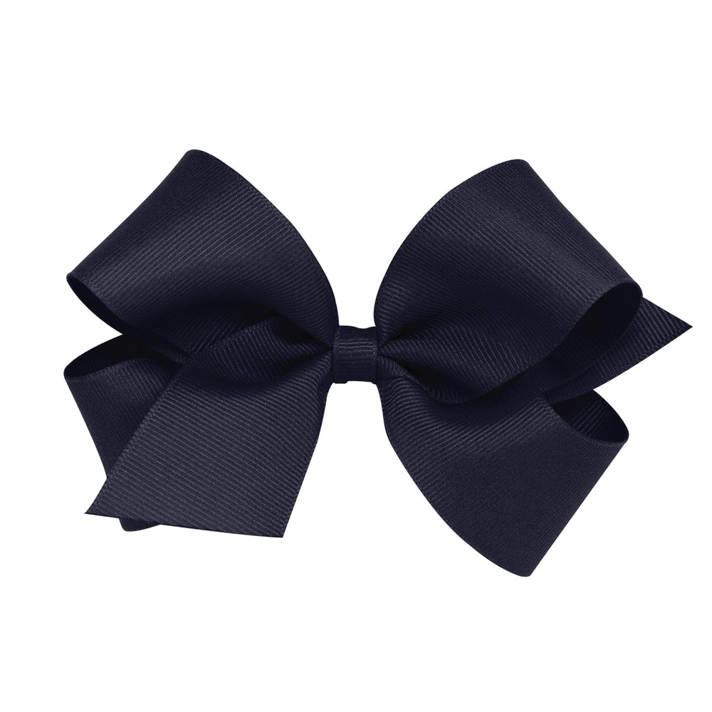 Wee Ones navy grosgrain bow on WeeStay clip stays securely in place all day.