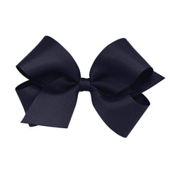 Wee Ones navy grosgrain bow on WeeStay clip stays securely in place all day.