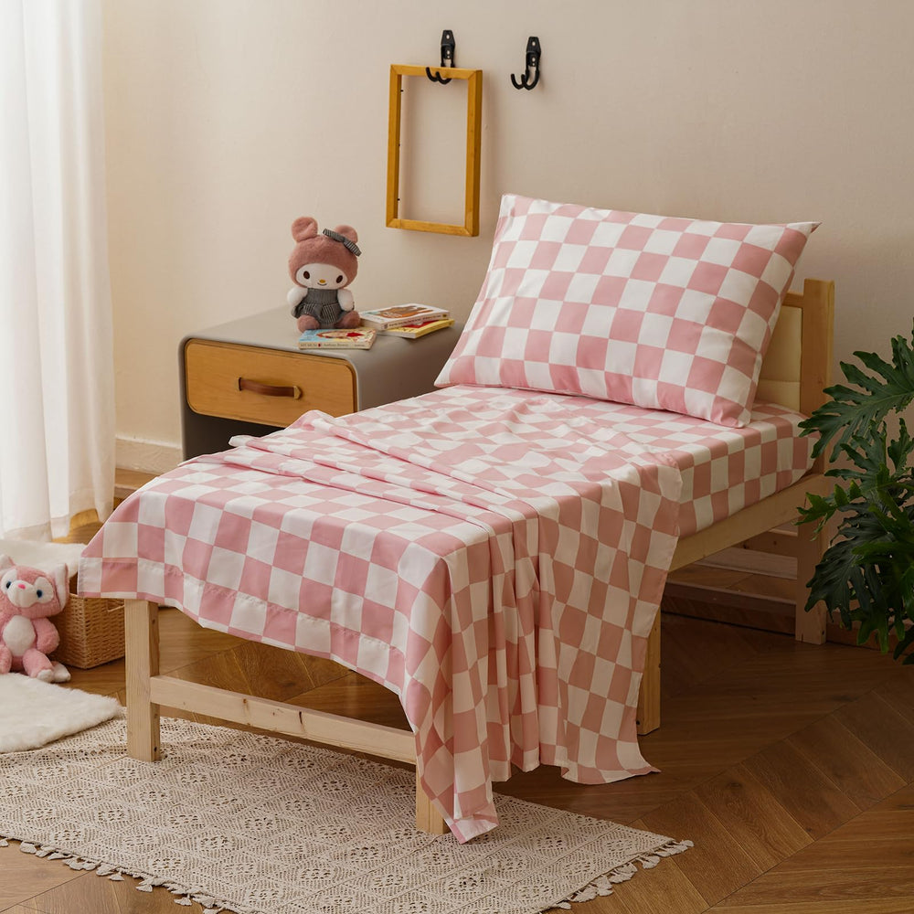 Wellboo pink white plaid fitted sheet showing snug elastic fit for secure sleep