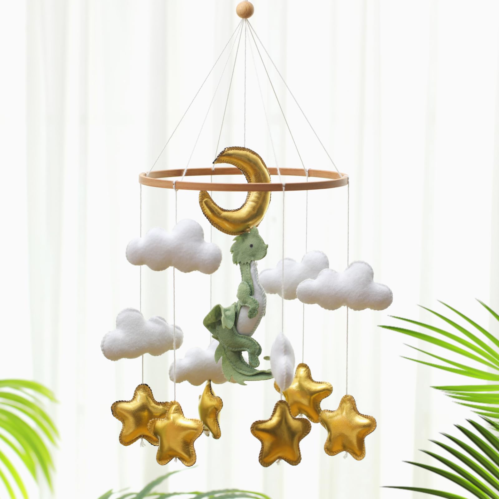 Wenqik woodland mobile easily hangs from the crib bracket.