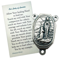 Westmon Works metal centerpiece detail, raised Our Lady image enhances custom rosaries for personal devotion.