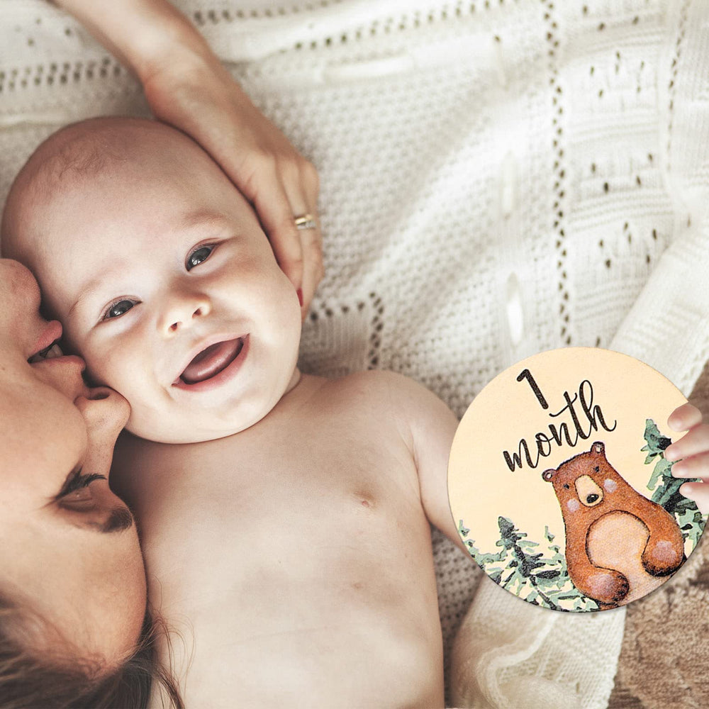 Whaline rustic design milestone props enhance pregnancy and baby milestone photos.