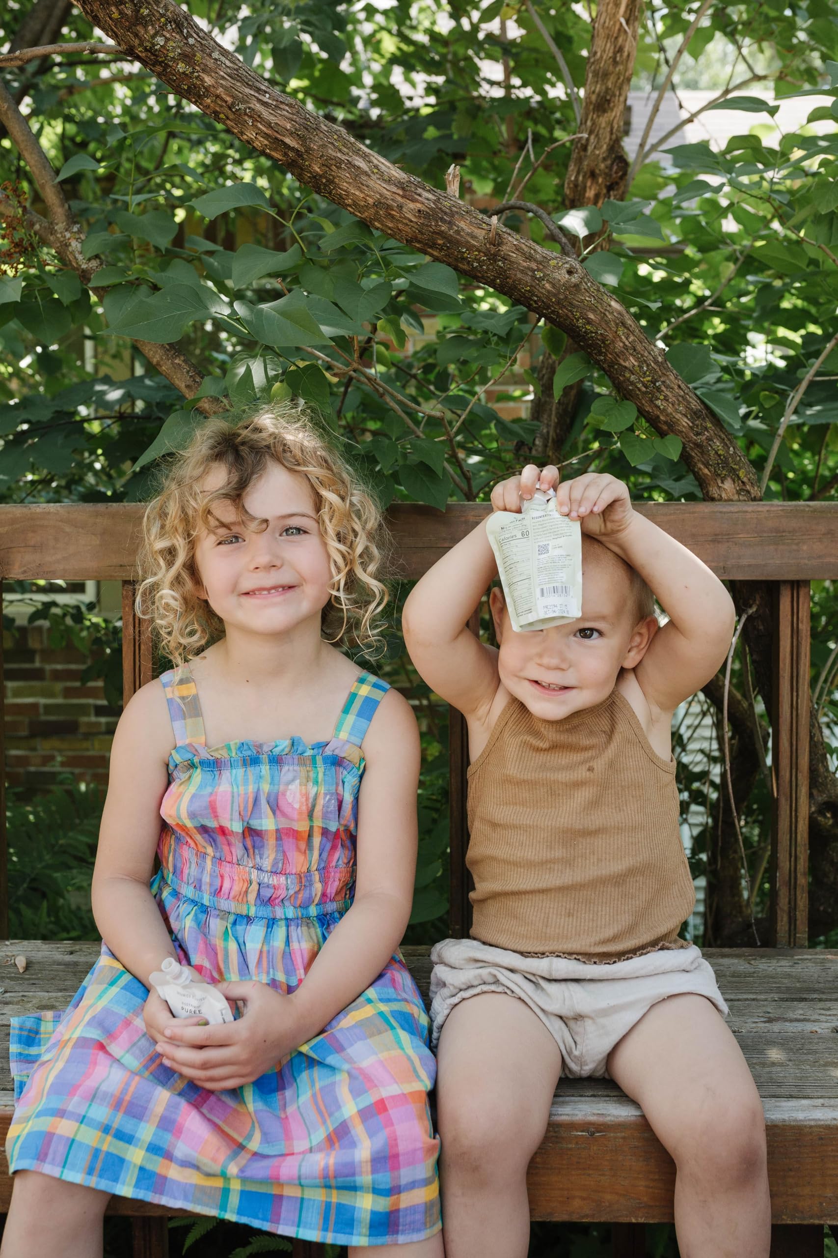 Pack of 24 White Leaf Provisions pouches stacked for family convenience.