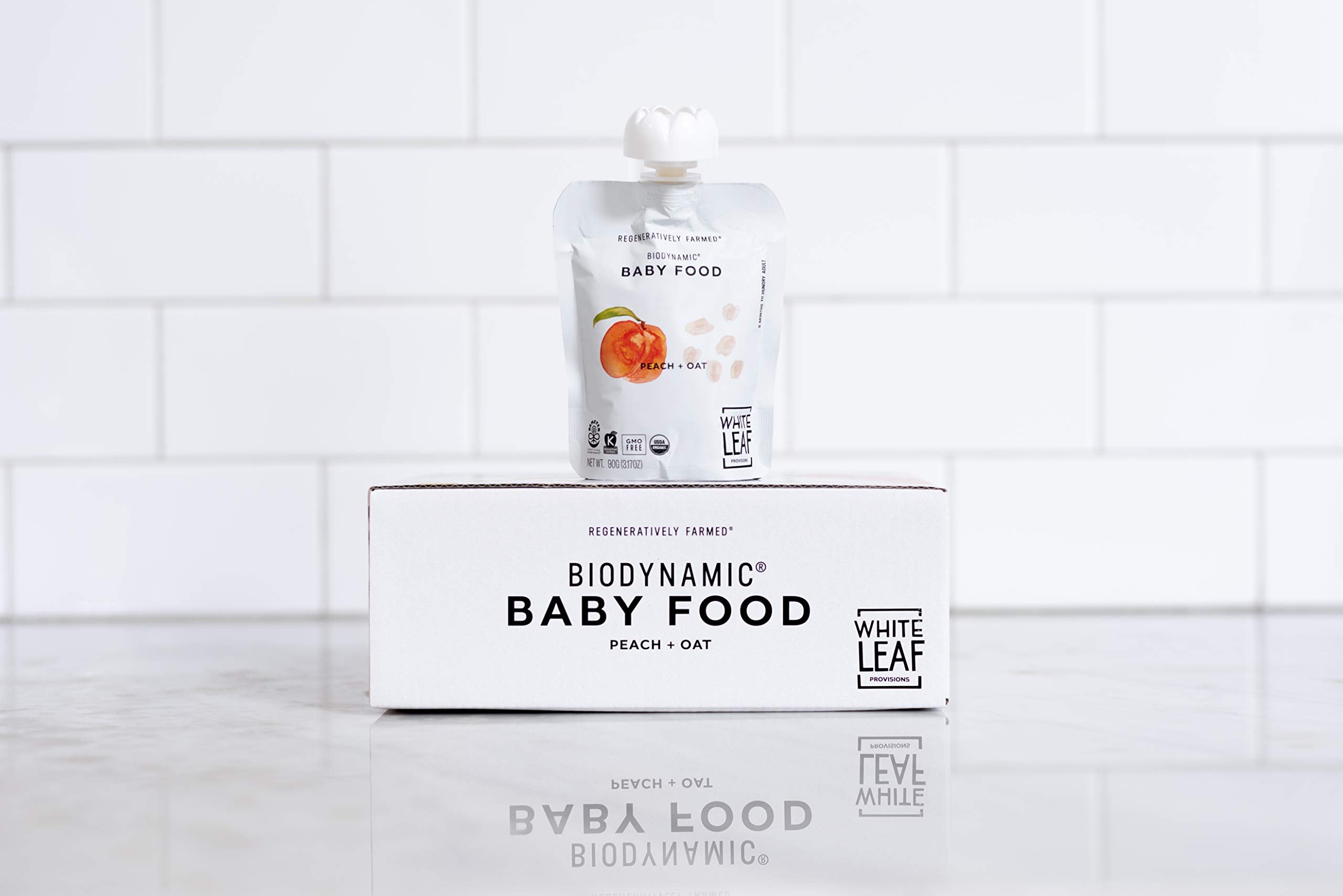 On-the-go White Leaf Provisions peach and oat puree pouch for little hands