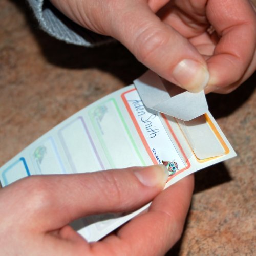 Whoozems bottle labels use semi-permanent adhesive for easy removal.
