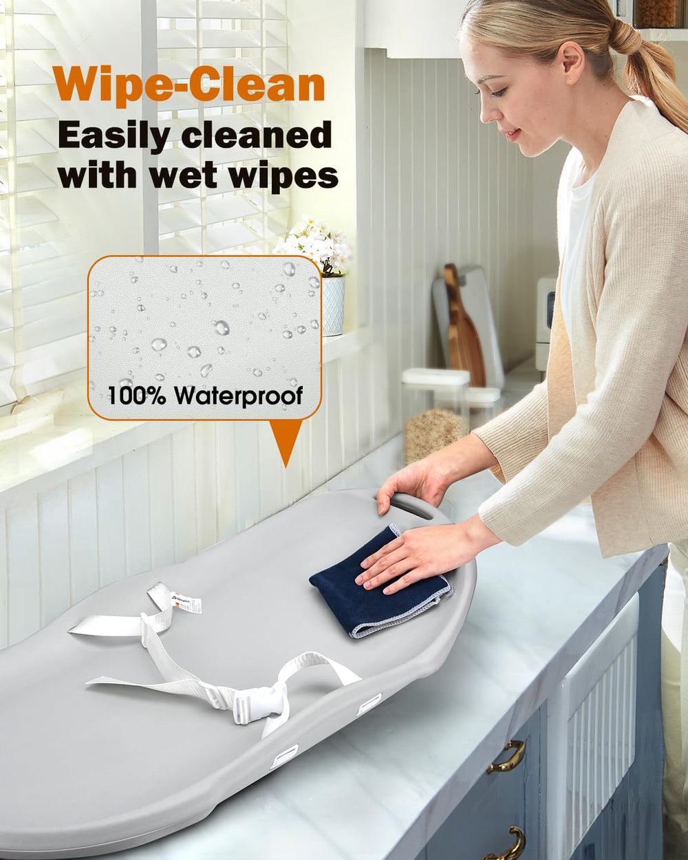 Widitn changing pad strap keeps baby secure during changes