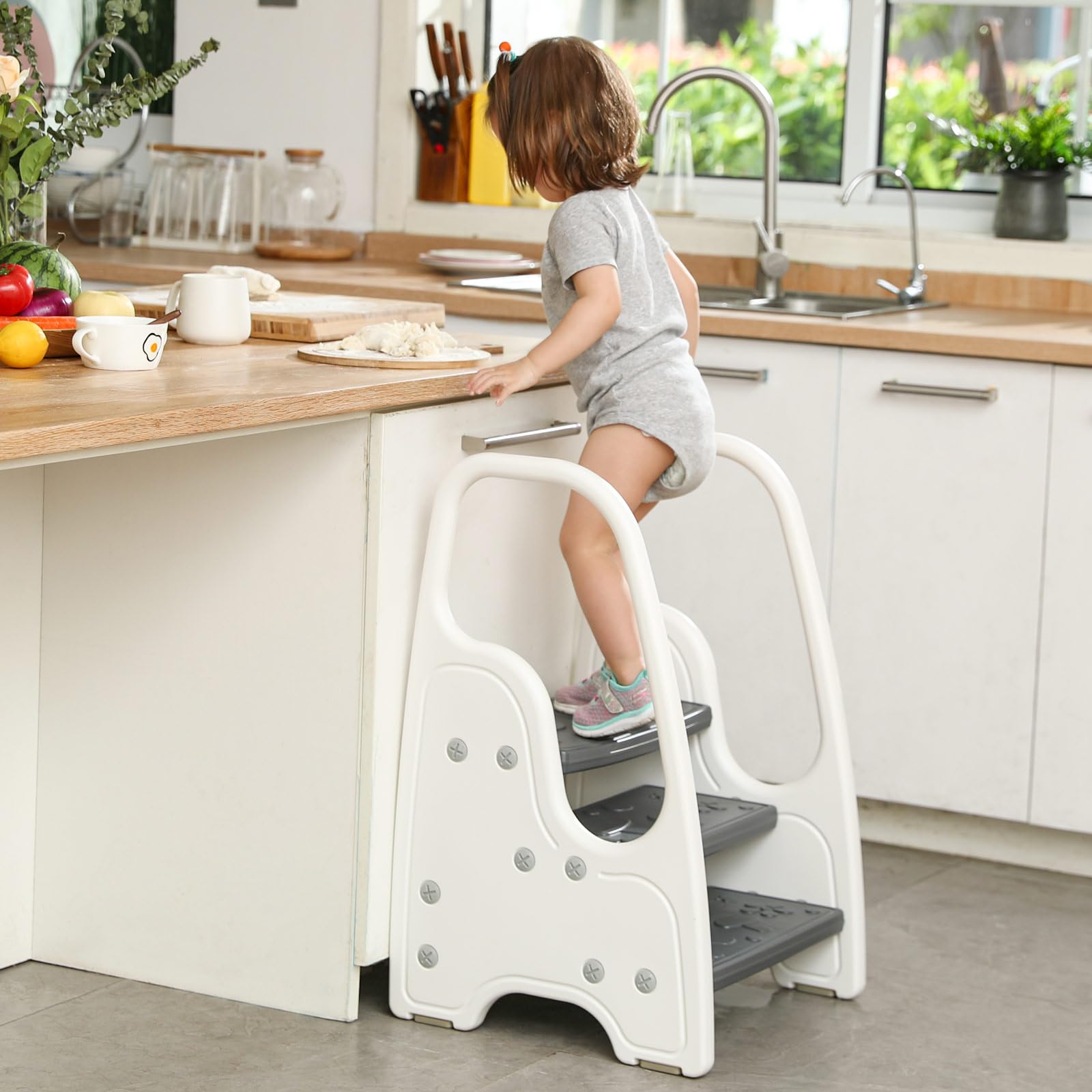 Wiifo adjustable 3-step stool grows with your child for various tasks.
