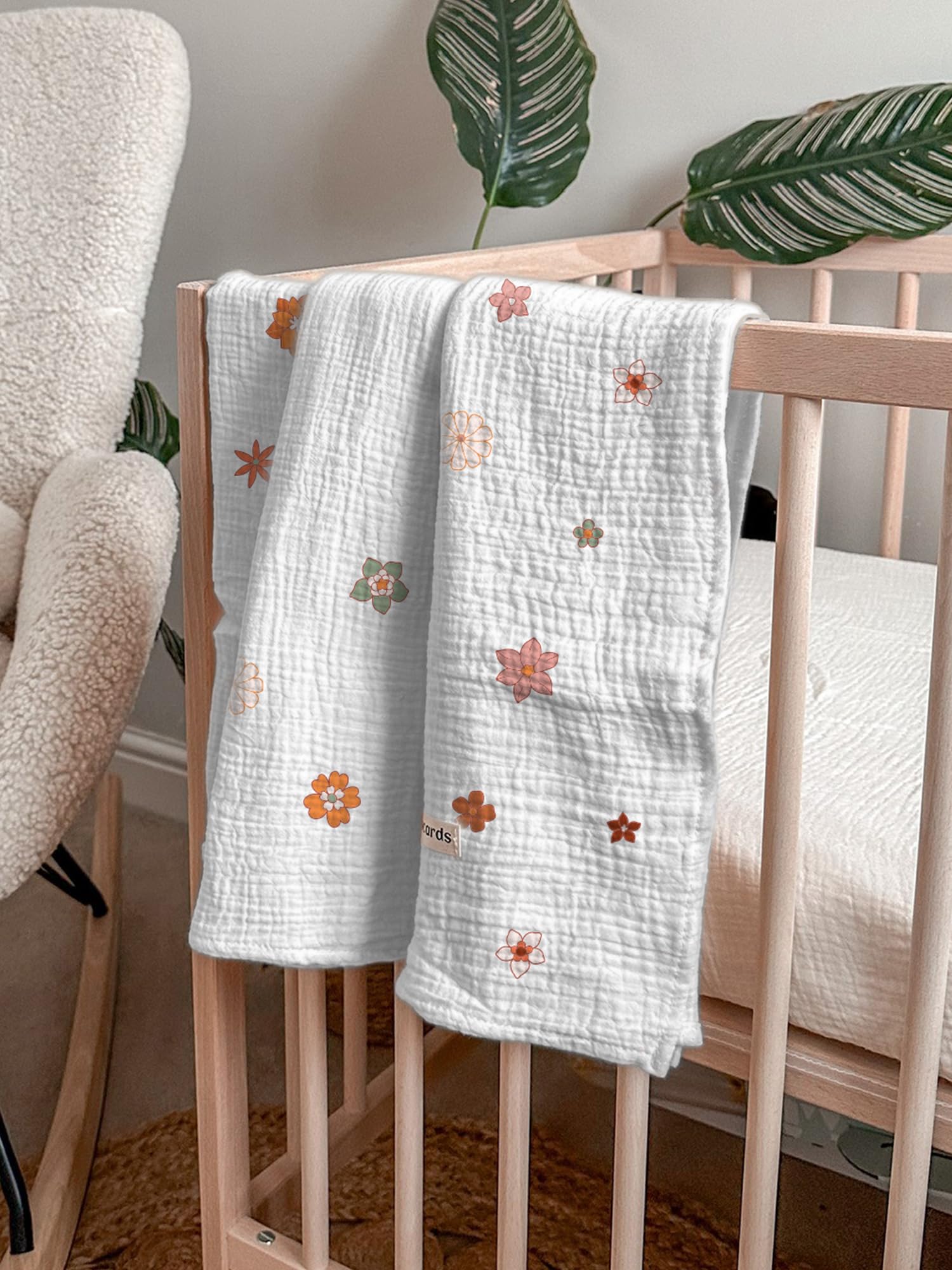 Wimist Flower-B swaddle functioning as a stroller cover during a sunny outing