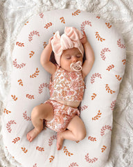Wimist envelope-closure design protects baby from zipper contact.