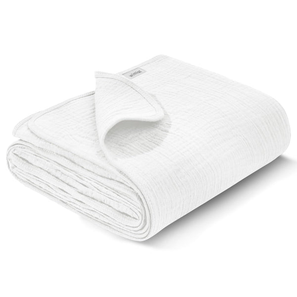 Wimist muslin swaddle blanket flat lay in white, showing versatile newborn care use