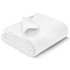 Wimist muslin swaddle blanket flat lay in white, showing versatile newborn care use