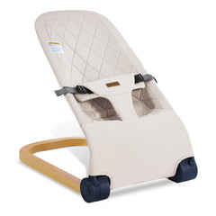 Winchild baby bouncer in wood grain style provides soothing motion for newborns.