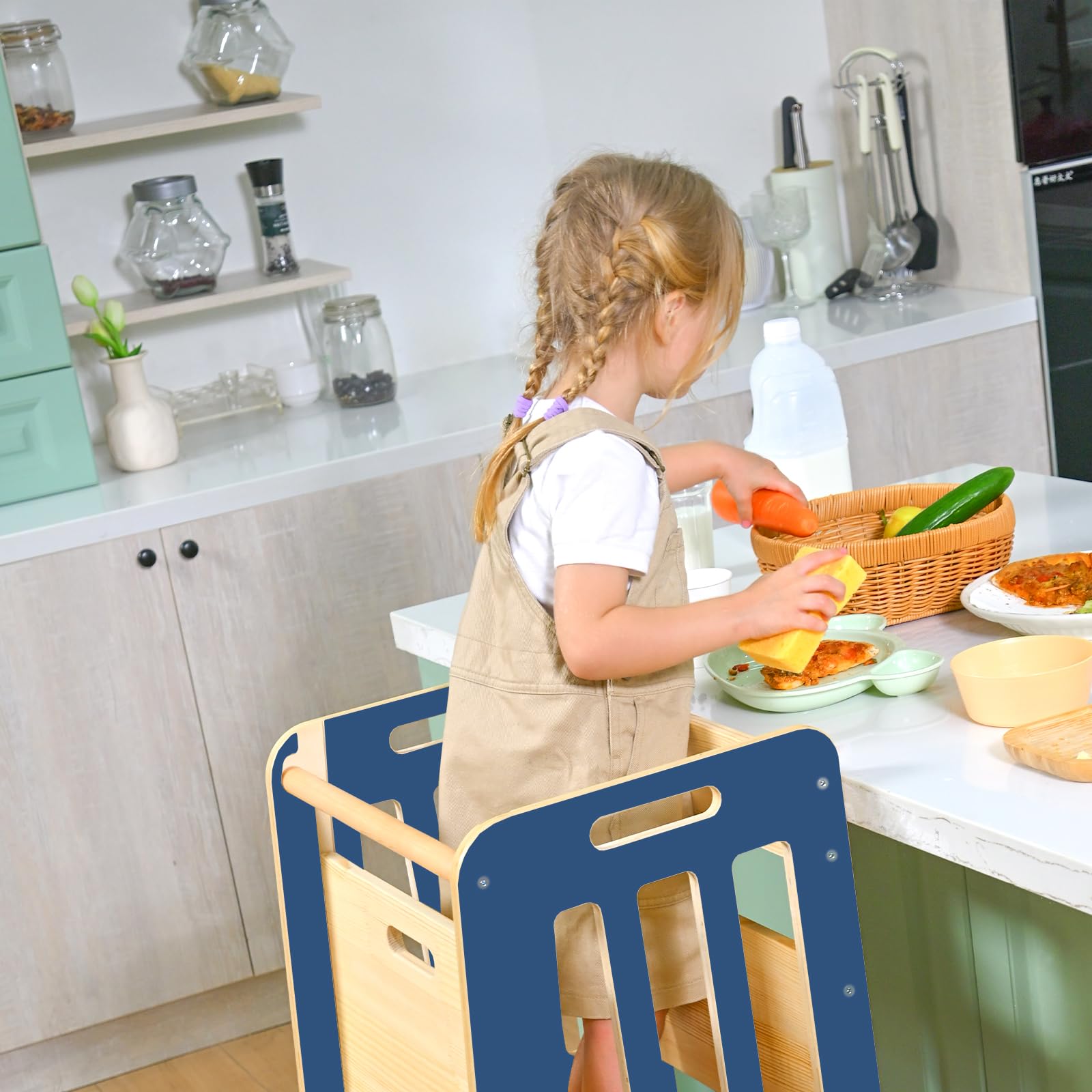Wingyz Toddler Tower fits beside standard counters for kitchen tasks.
