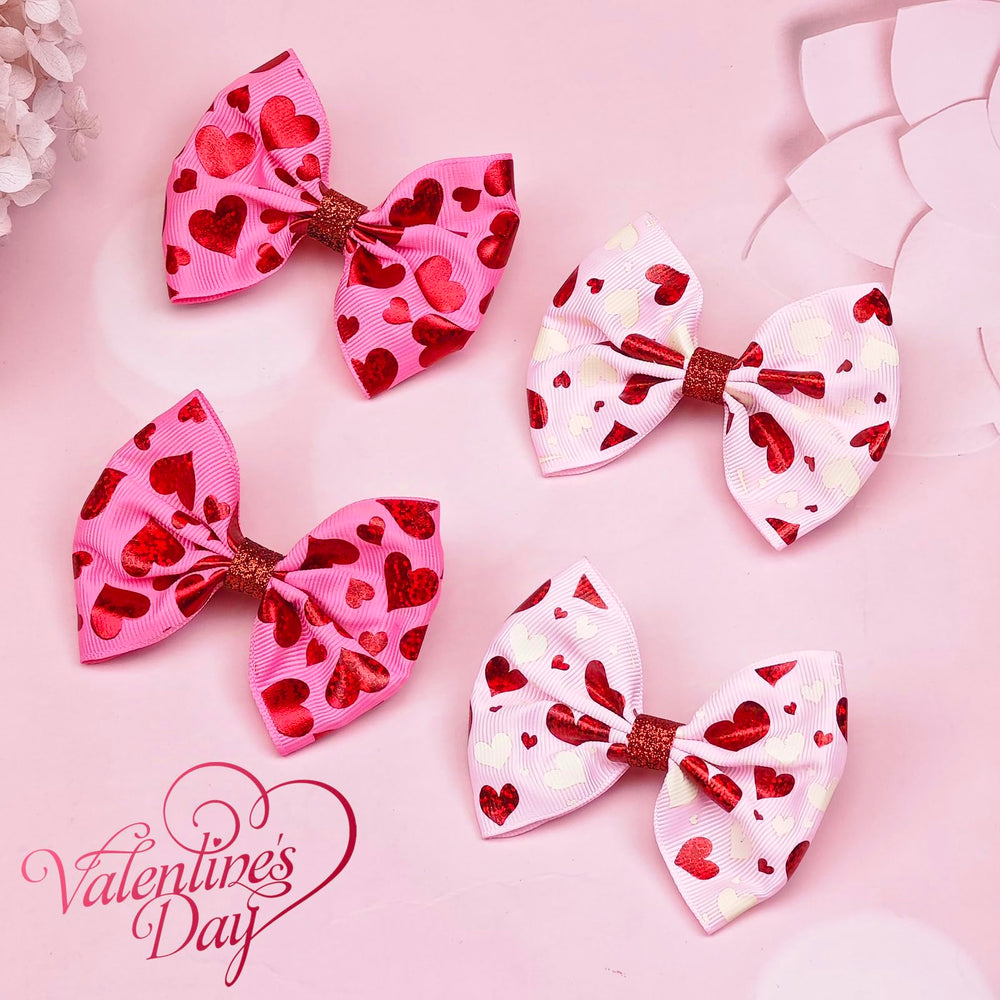 Winthrop heart-pattern glitter bow hair clip close-up for festive appeal.