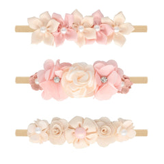 WNYUJOY baby flower headbands set in pink gift box with coordinating colors.