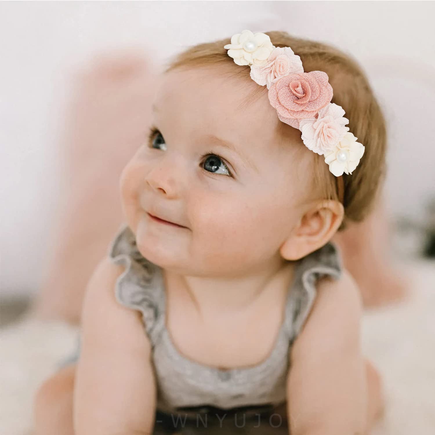 WNYUJOY handmade natural flower on a lightweight fabric for delicate outfits.