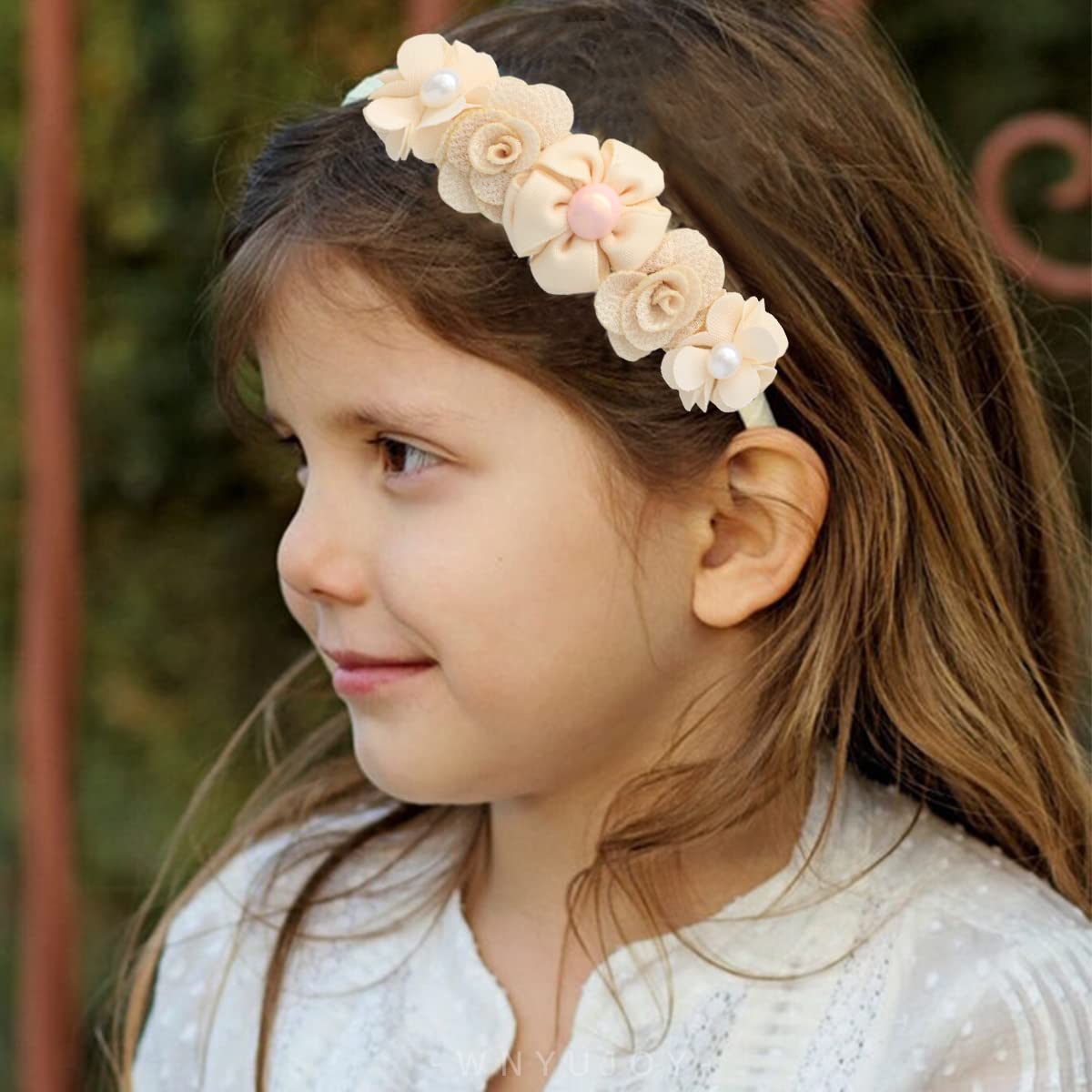 WNYUJOY baby headband on infant demonstrates comfortable fit.