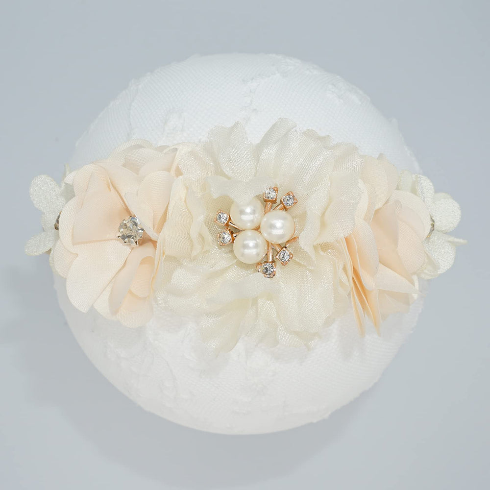 WNYUJOY baby wearing flower headband for photography and everyday outfits.