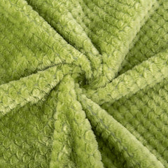 Wonder Miracle baby blanket folded neatly, portable for trips and stroller use.