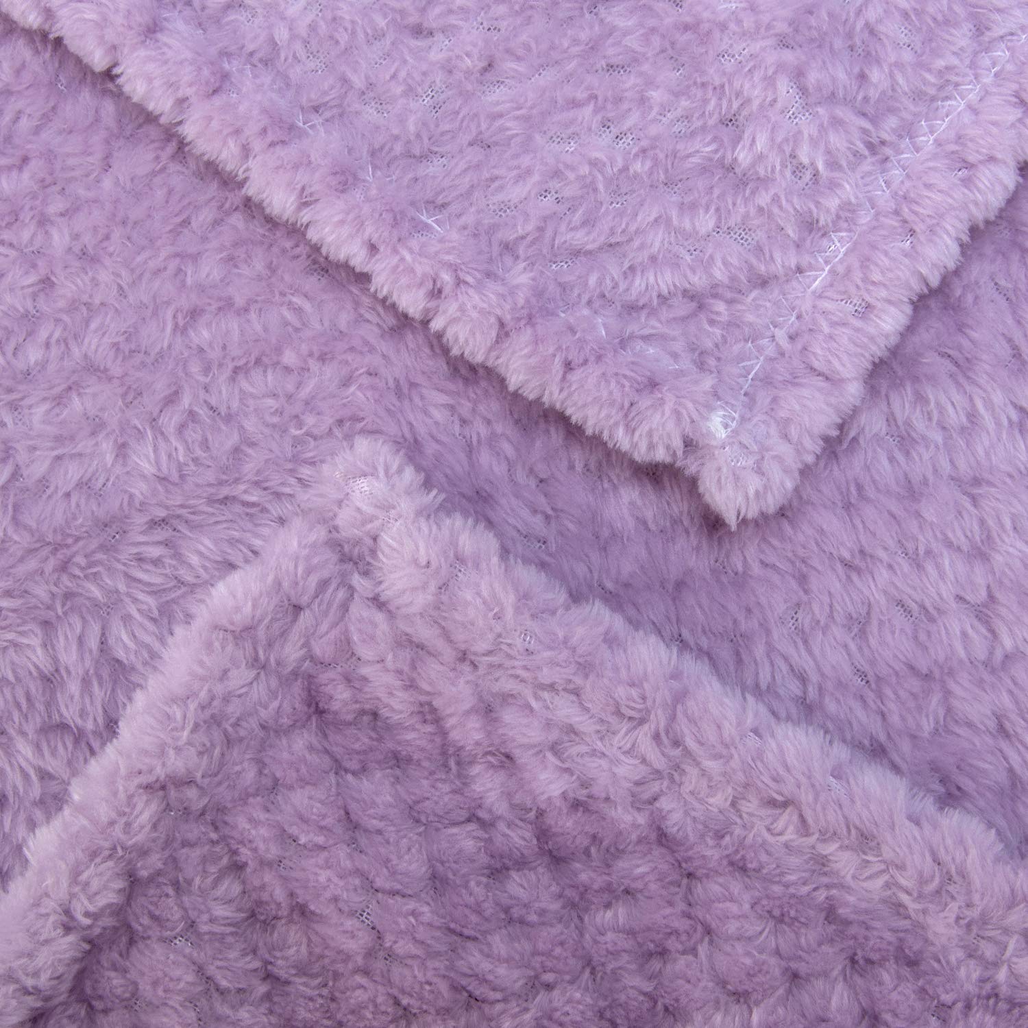Wonder Miracle lavender blanket offers a gentle layer for bedtime comfort.