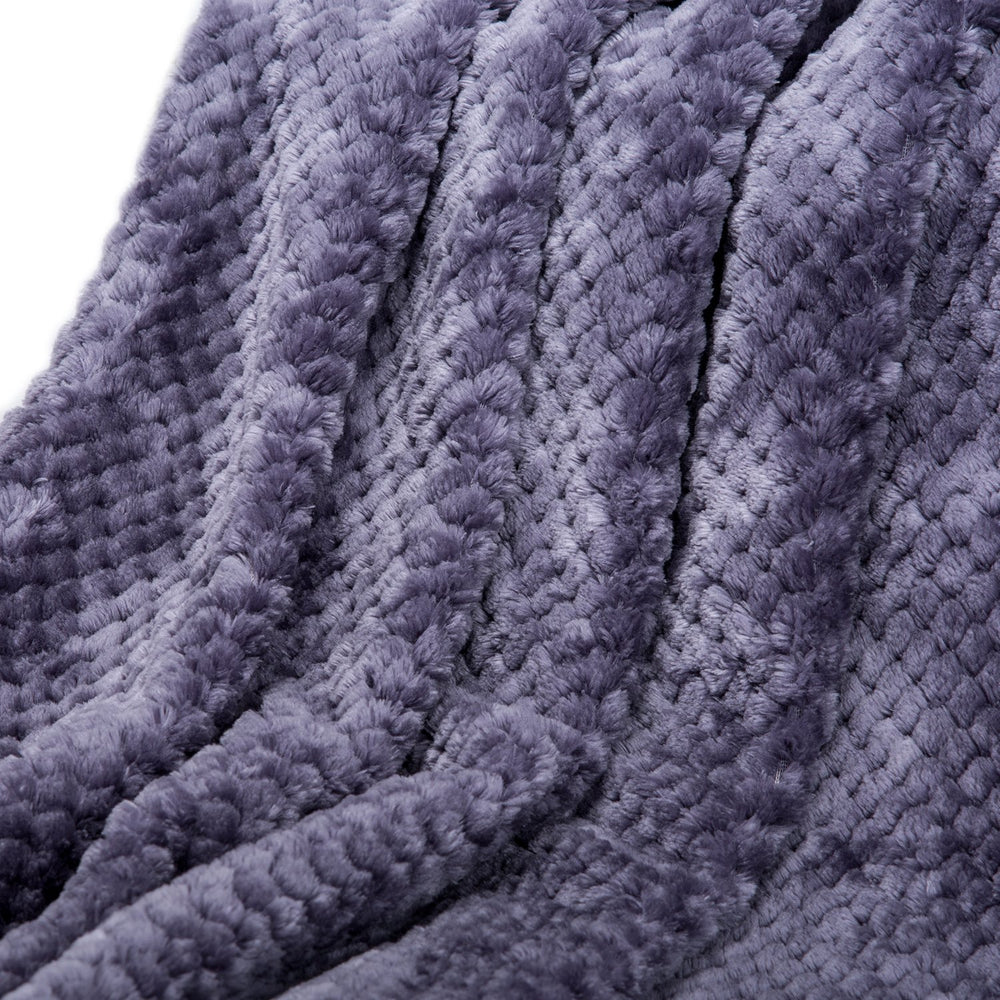 WONDER MIRACLE fuzzy blanket draped over crib rail, decorative and soft