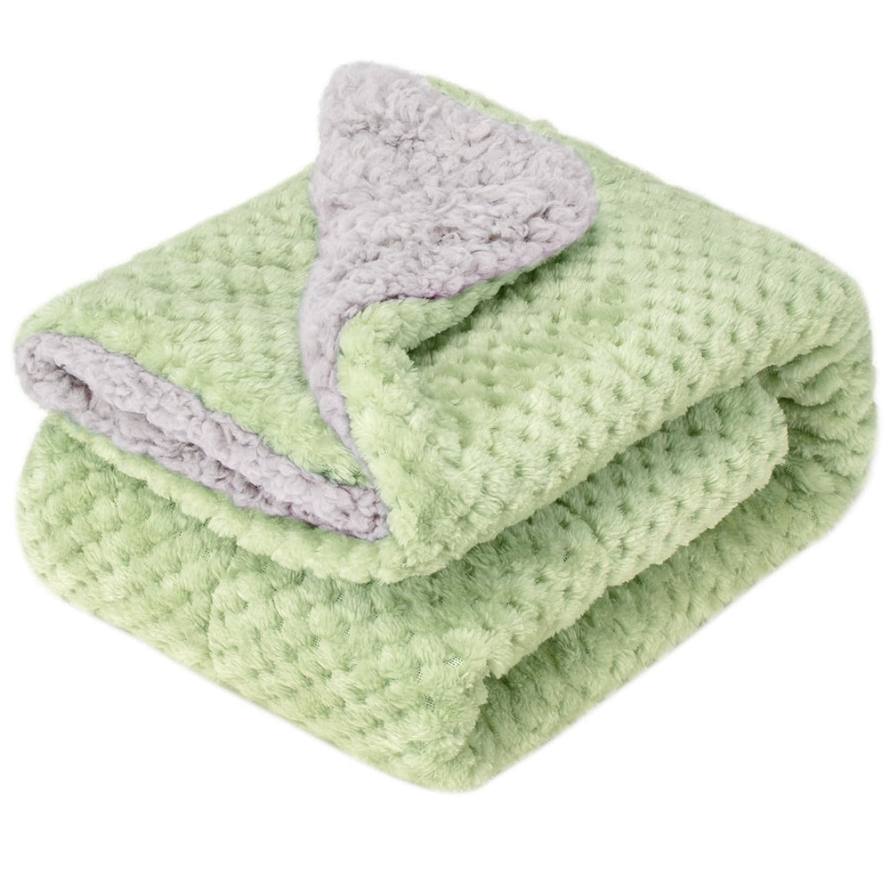 Wonder Miracle fuzzy sherpa blanket on a sleeping baby for cozy warmth.