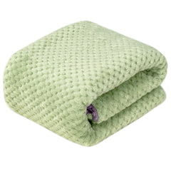 Wonder Miracle fuzzy sherpa blanket placed in a crib for all-season warmth.