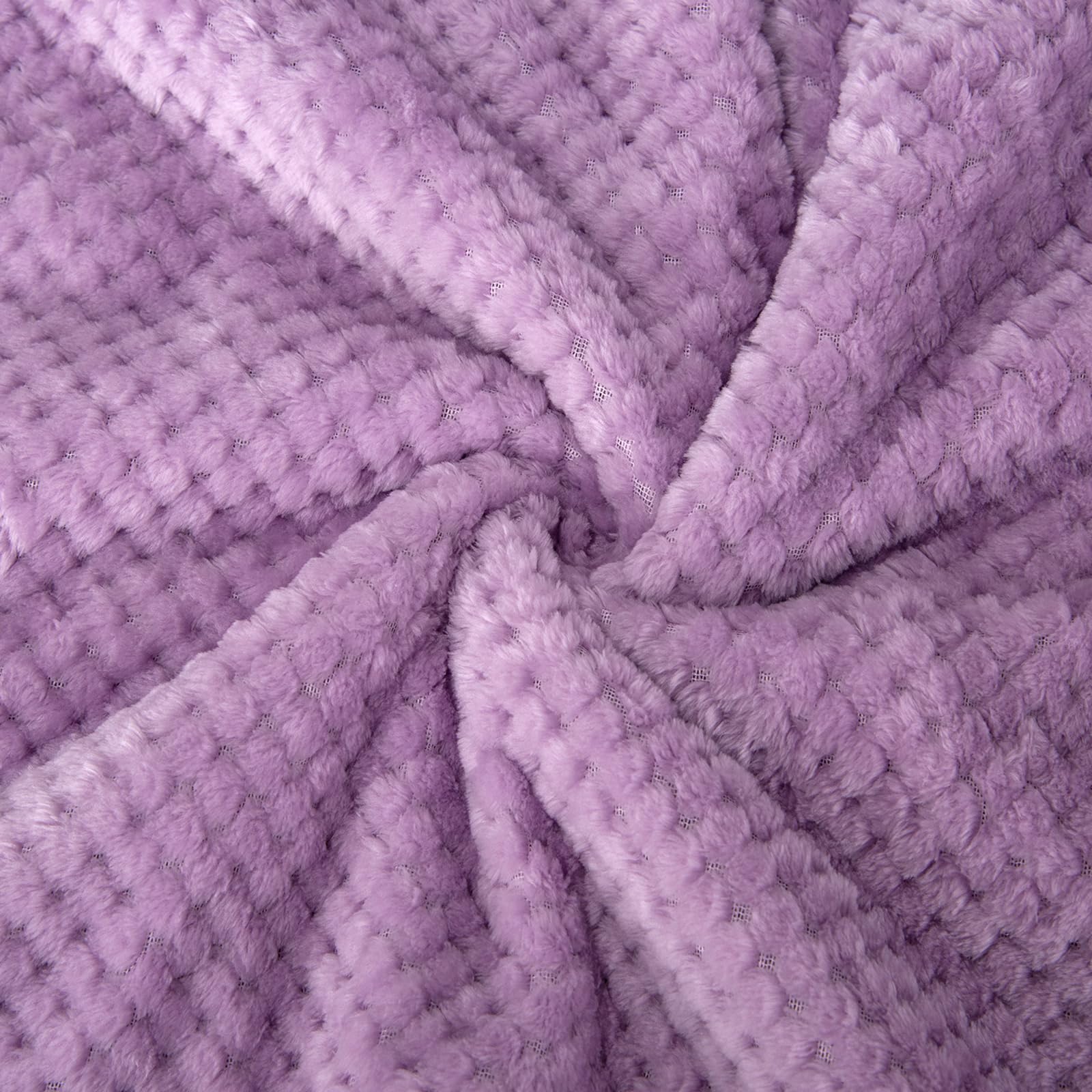 Wonder Miracle fuzzy sherpa blanket in lavender tone enhances nursery aesthetics and comfort.