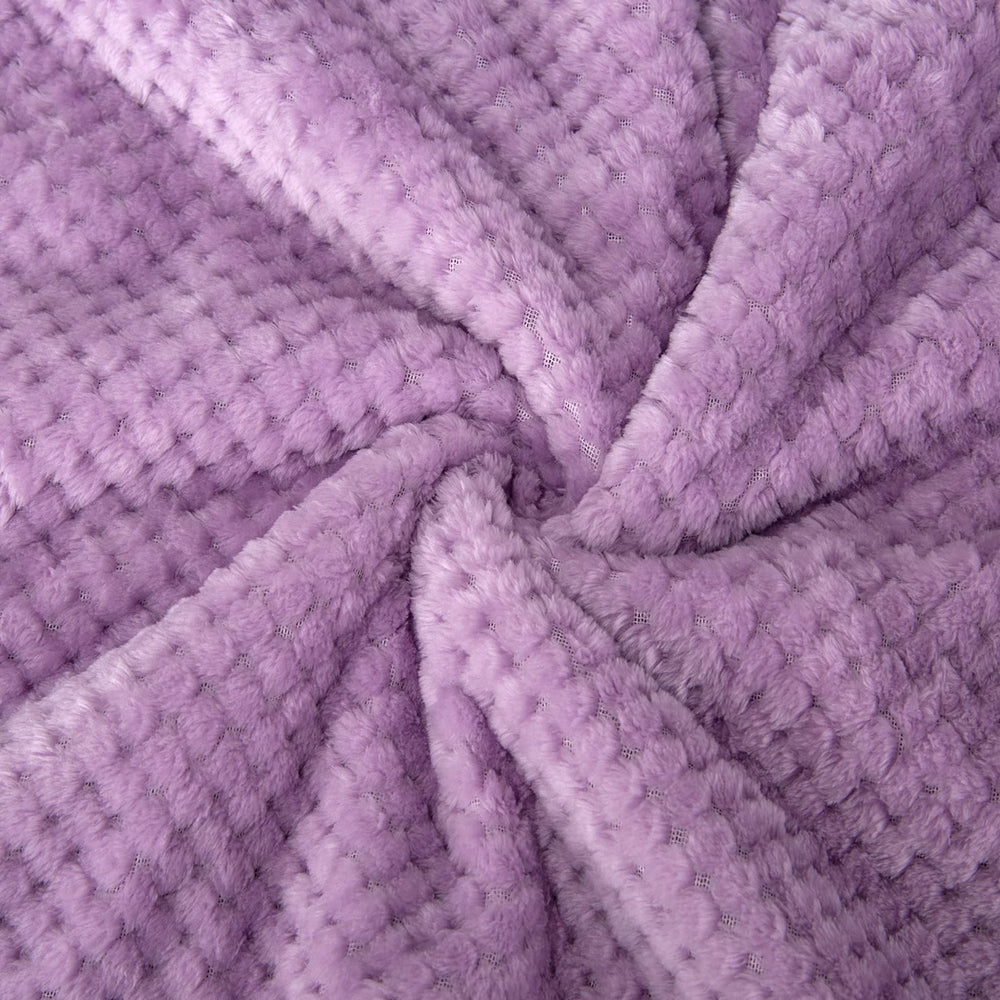 Wonder Miracle fuzzy sherpa blanket in lavender tone enhances nursery aesthetics and comfort.