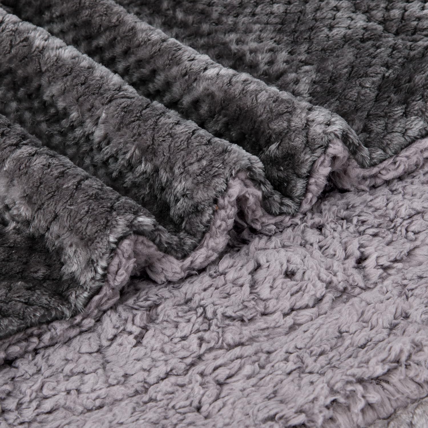 Travel-friendly Wonder Miracle blanket folded beside a bag demonstrates easy packing.
