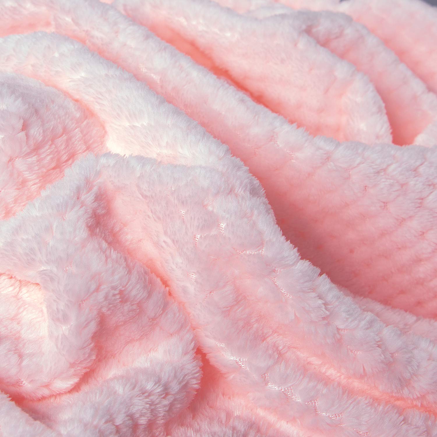 Wonder Miracle fuzzy throw blanket on bed demonstrates all-season comfort.