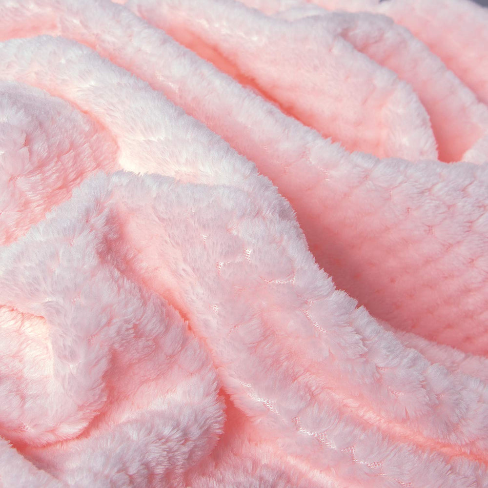 Wonder Miracle fuzzy throw blanket on bed demonstrates all-season comfort.