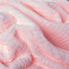 Wonder Miracle fuzzy throw blanket on bed demonstrates all-season comfort.