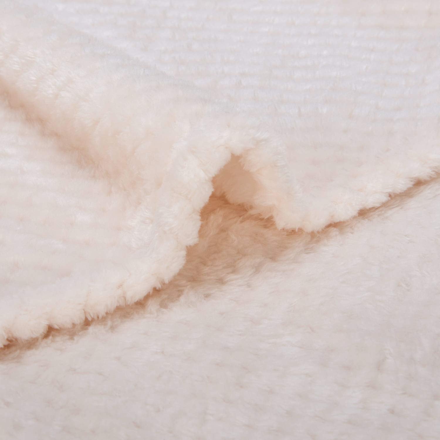 WONDER MIRACLE cream blanket spread on bed for cuddly evenings