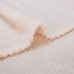 WONDER MIRACLE cream blanket spread on bed for cuddly evenings