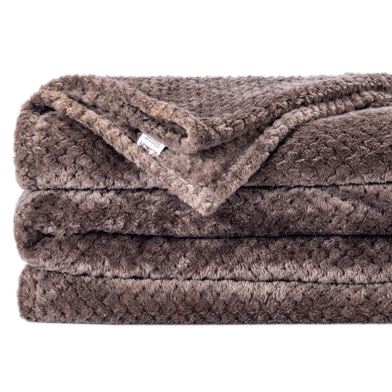 Wonder Miracle fuzzy throw blanket on a couch for relaxed evenings.