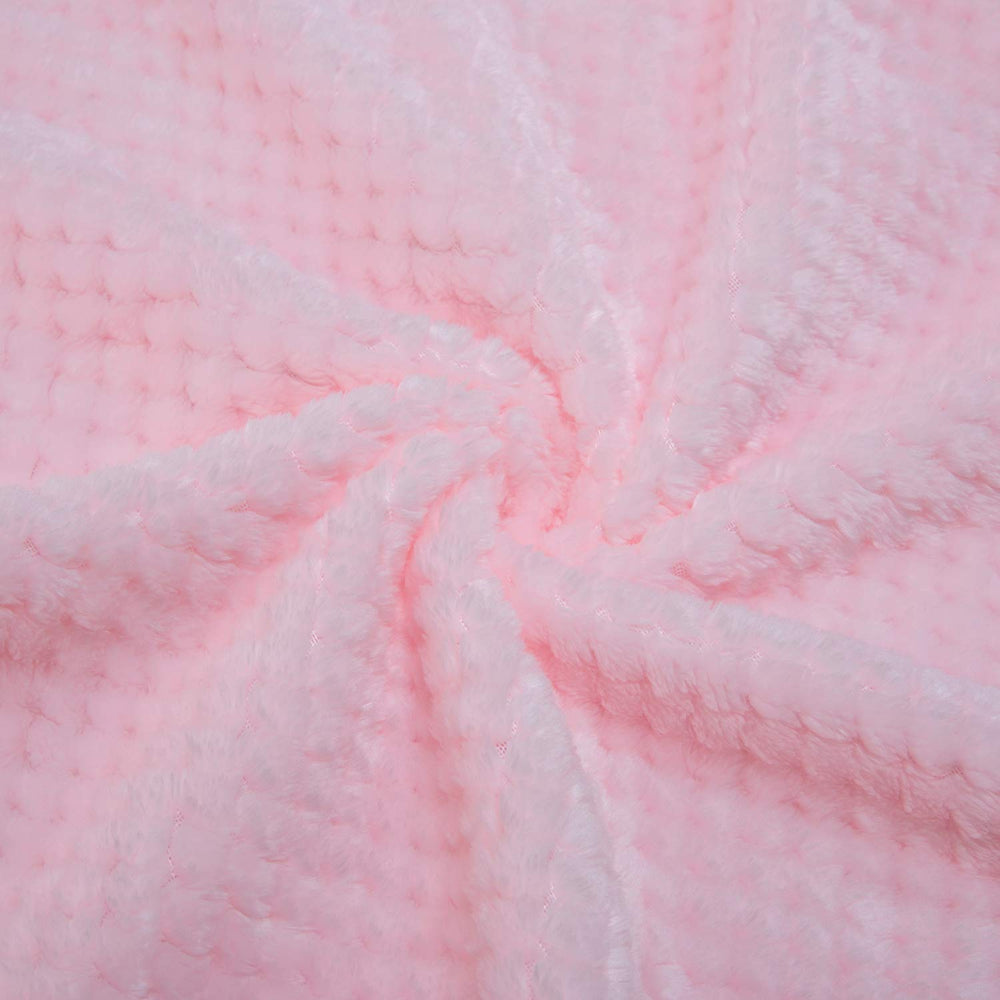 Wonder Miracle plush fleece blanket draped on bed for warm nights and relaxation.