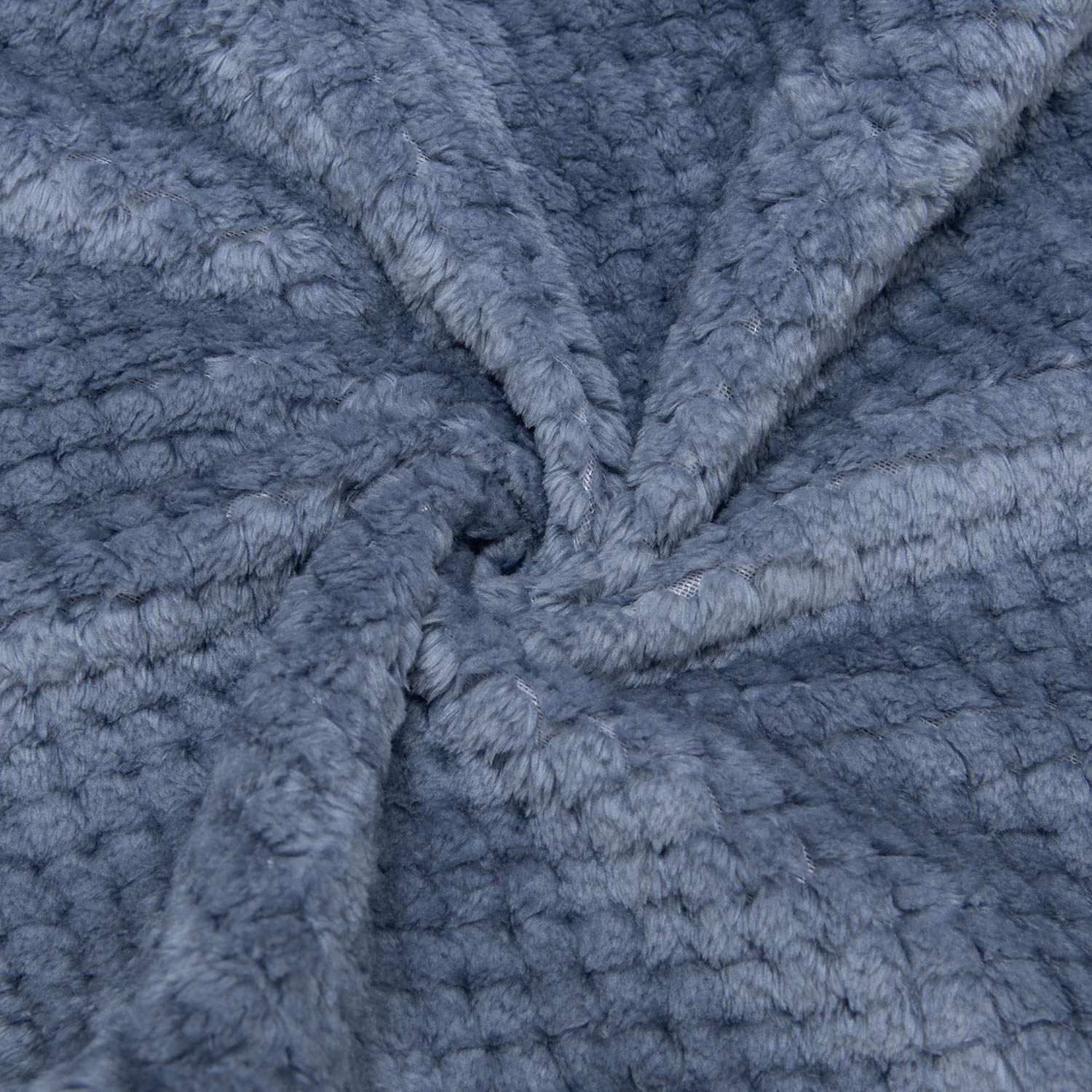 Wonder Miracle fuzzy throw blanket folded neatly, ideal for travel and portability.