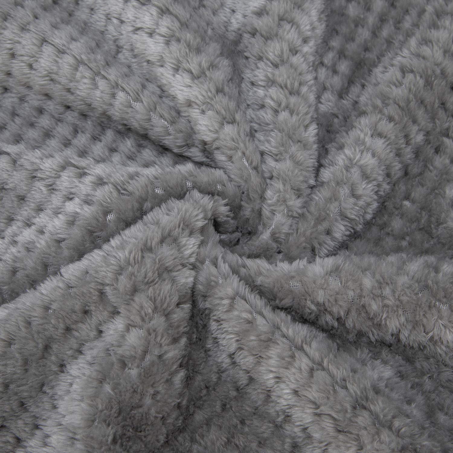 Wonder Miracle fuzzy throw blanket on a bed for all-season comfort