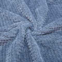 Wonder Miracle fuzzy throw blanket on sofa for cozy lounging