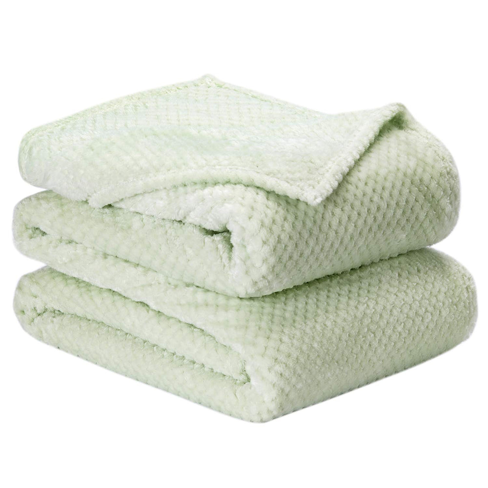 Wonder Miracle fuzzy throw blanket on bed, queen size for cozy warmth