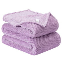 Wonder Miracle fuzzy throw blanket in soft fleece offers cozy warmth for bed.