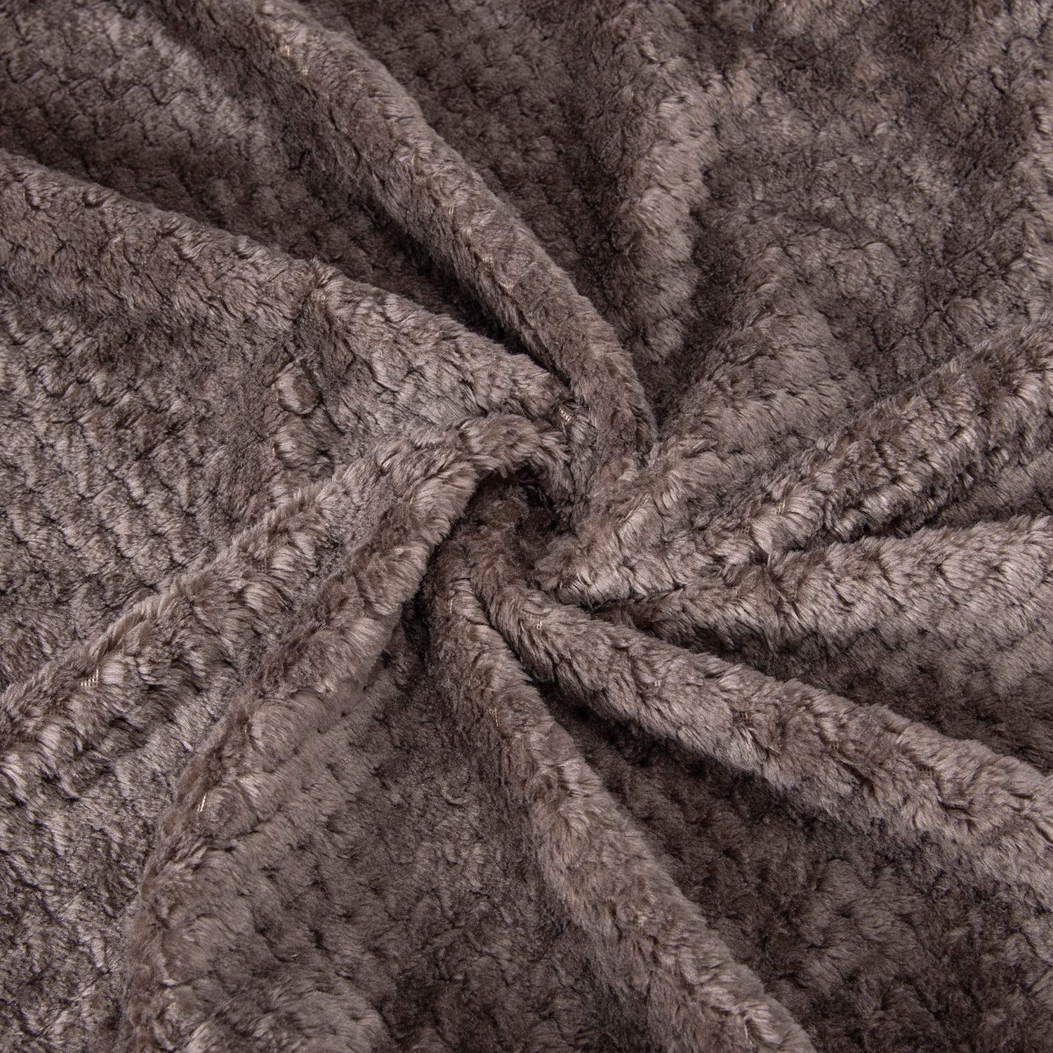 Wonder Miracle fuzzy throw blanket close-up shows soft micro fleece texture.