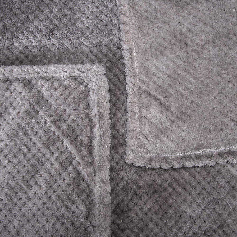 Wonder Miracle fuzzy throw blanket packed for travel and outdoor use